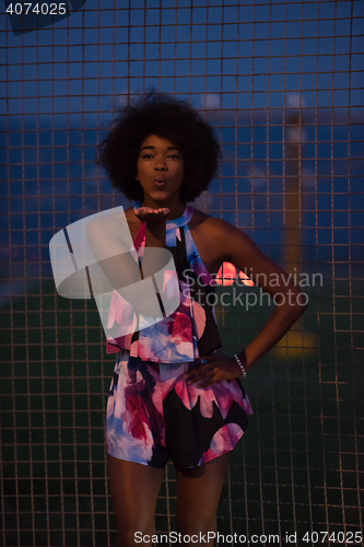 Image of portrait of a young African-American woman in a summer dress