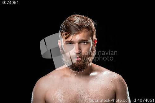 Image of The water splash on male face