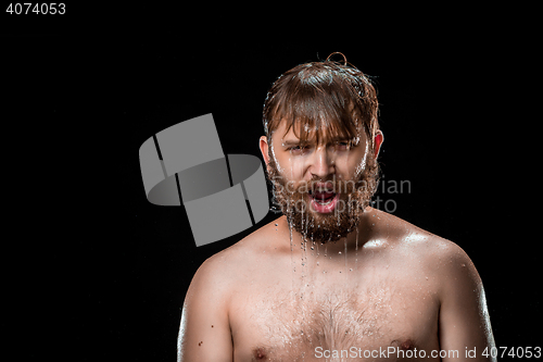 Image of The water splash on male face