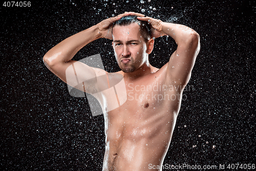 Image of The water splash on male face