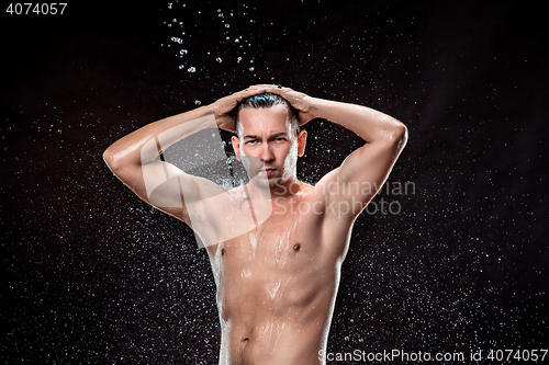 Image of The water splash on male face