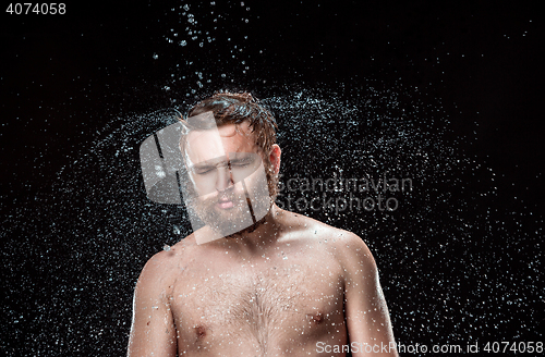 Image of The water splash on male face