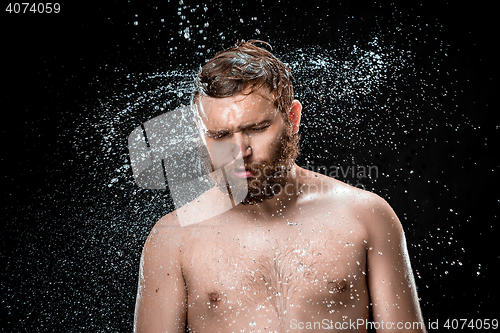 Image of The water splash on male face