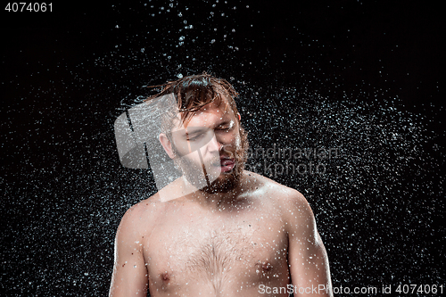 Image of The water splash on male face