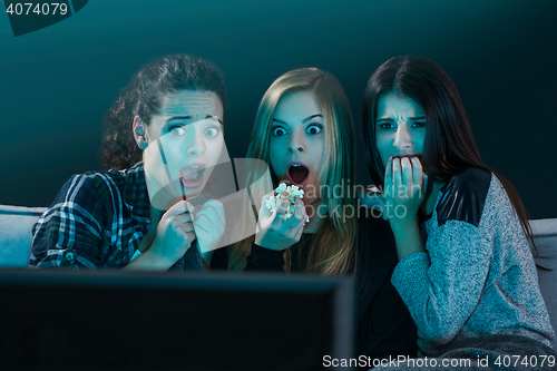 Image of Scared teenage watching movies 