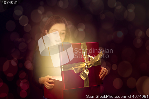 Image of Little girl opening a magic box