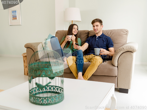 Image of Watching tv and drinking coffee
