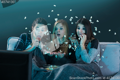 Image of Scared teenage watching movies 