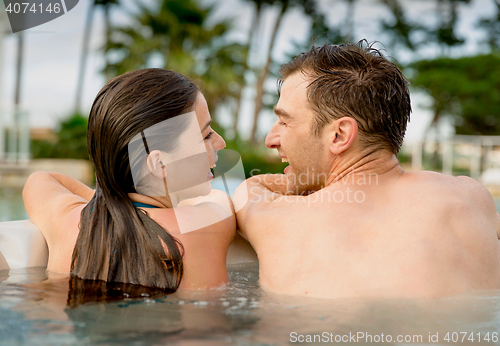 Image of Young couple in a jacuzzi
