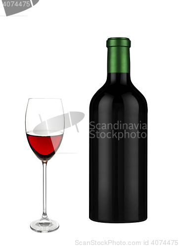 Image of Glass of red wine and a bottle