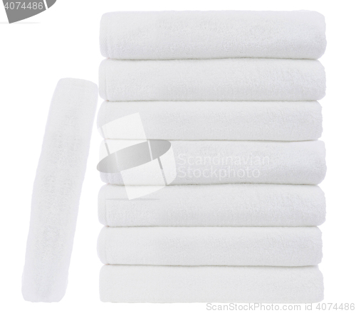 Image of Stack of white plush hotel towels