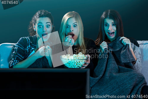 Image of Scared teenage watching movies 