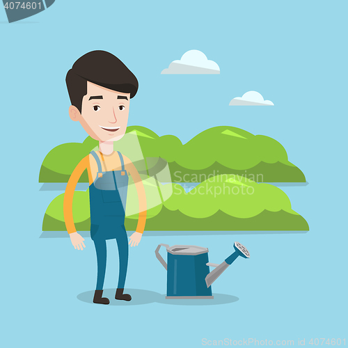 Image of Farmer with watering can at field.