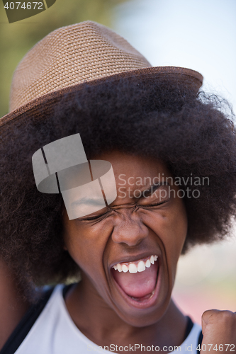 Image of Close up portrait of a beautiful young african american woman sm