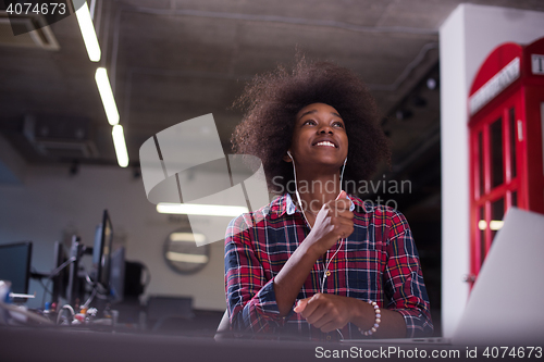 Image of portrait of a young successful African-American woman in modern 