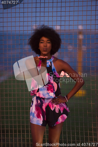 Image of portrait of a young African-American woman in a summer dress