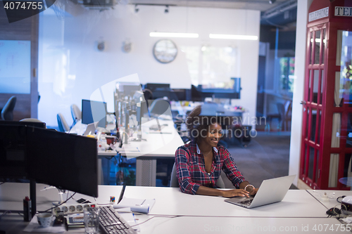 Image of portrait of a young successful African-American woman in modern 