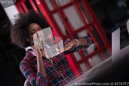 Image of portrait of a young successful African-American woman in modern 