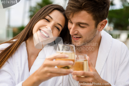Image of Young couple tasting wine