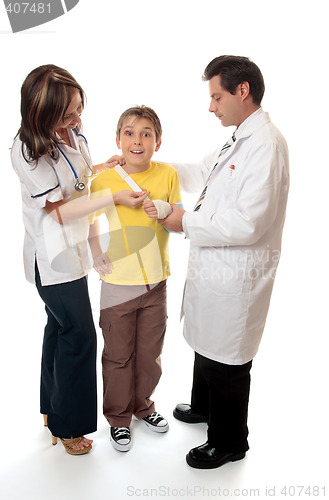 Image of Doctor and nurse assist patient