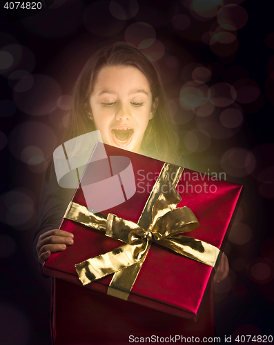 Image of Little girl opening a magic box