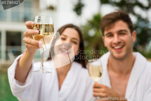 Image of Young couple tasting wine