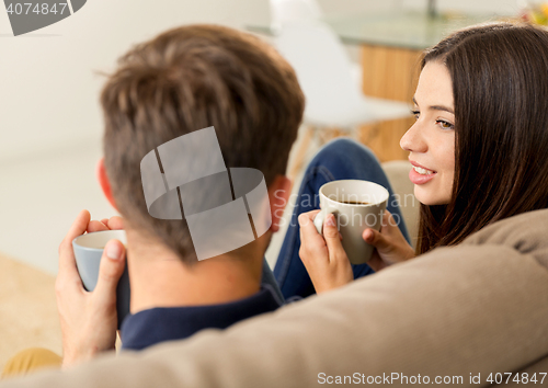 Image of Young couple drinking coffee