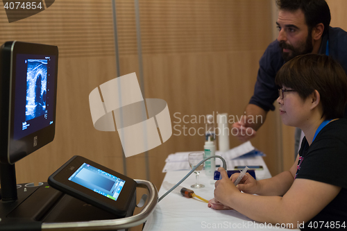 Image of Participants learning new ultrasound techniques on medical congress.