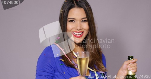 Image of Gorgeous young woman celebrating with champagne