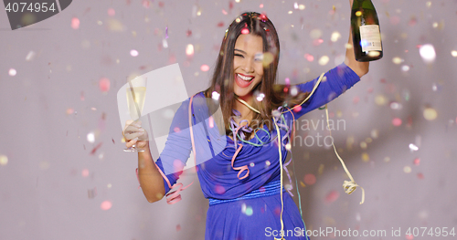 Image of Giggling happy woman celebrating the New Year