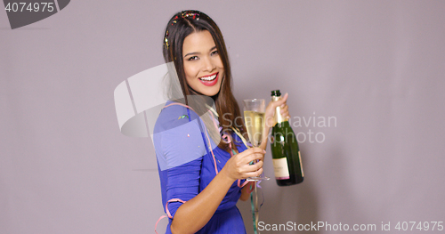 Image of Young woman partying as she celebrates New Year