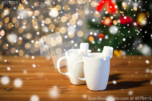 Image of cups of hot chocolate with marshmallow on wood