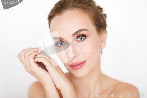 Image of beautiful young woman face and hands