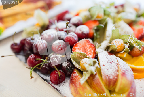 Image of close up of dish with sugared fruit dessert