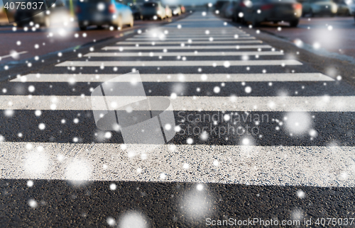 Image of close up of pedestrian crosswalk on city parking