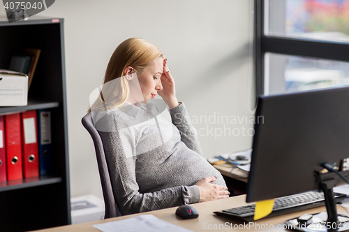 Image of pregnant businesswoman feeling sick at office work