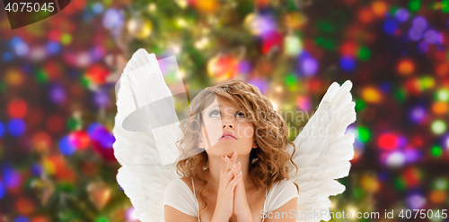 Image of praying teenage angel girl or young woman