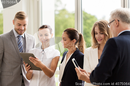 Image of business people with tablet pc computers at office