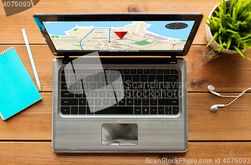 Image of close up of laptop computer with gps navigator map