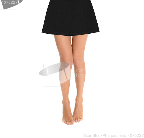 Image of Woman legs in a skirt isolated