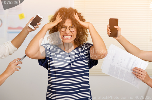 Image of Busy woman at the office