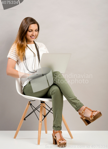 Image of Woman working with a lapptop