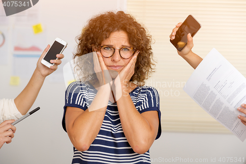 Image of Busy woman at the office