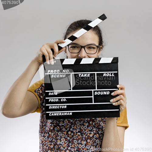 Image of Woman with a clapboard