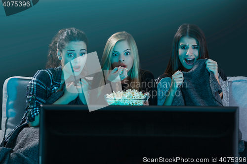 Image of Scared teenage watching movies 