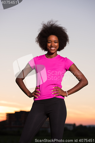 Image of Portrait of a young african american woman running outdoors