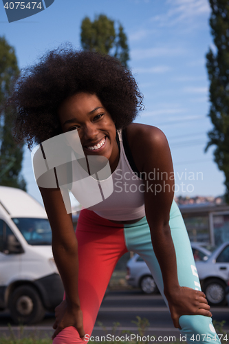 Image of Portrait of sporty young african american woman running outdoors