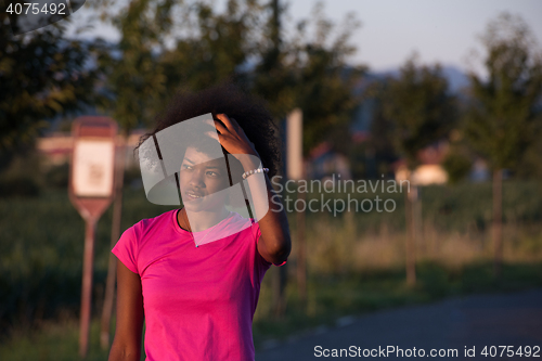 Image of Portrait of a young african american woman running outdoors