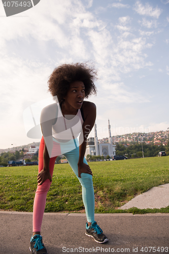 Image of Portrait of sporty young african american woman running outdoors