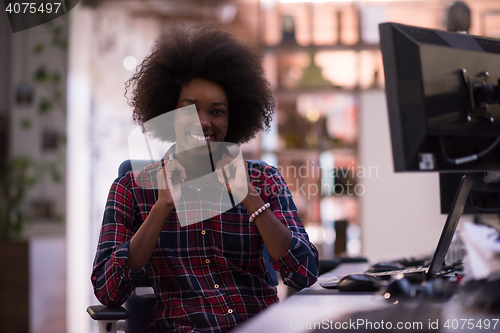 Image of portrait of a young successful African-American woman in modern 